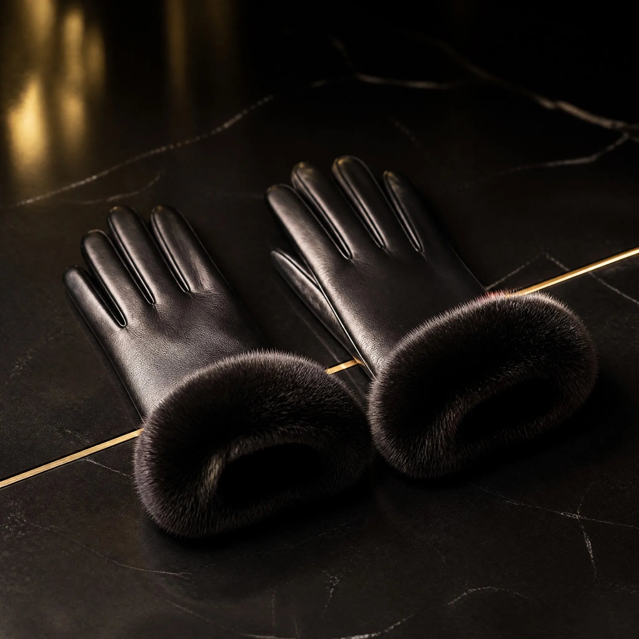 Black leather gloves with mink fur cuffs by Maison Fourrure